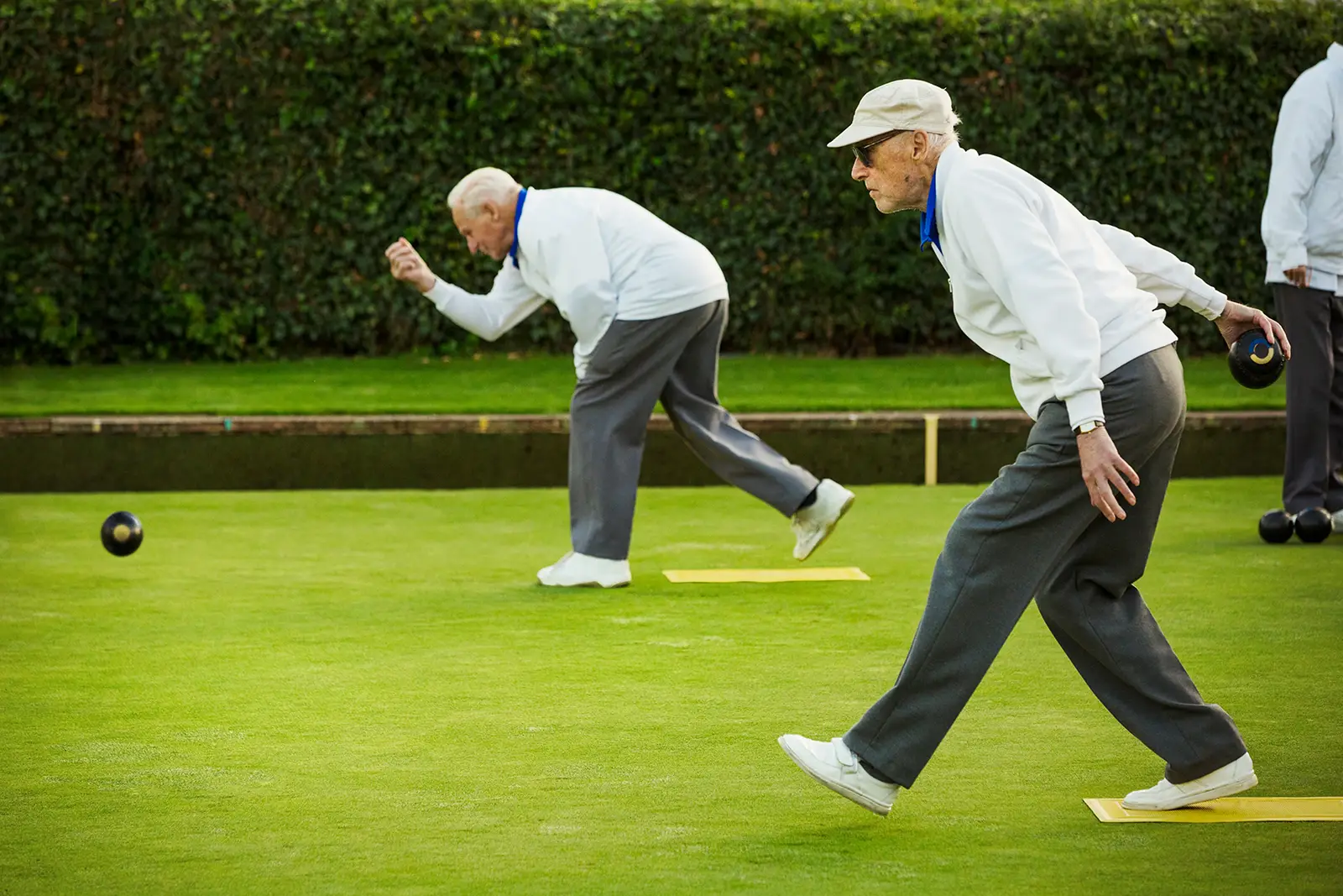 Two elderly men playing outside