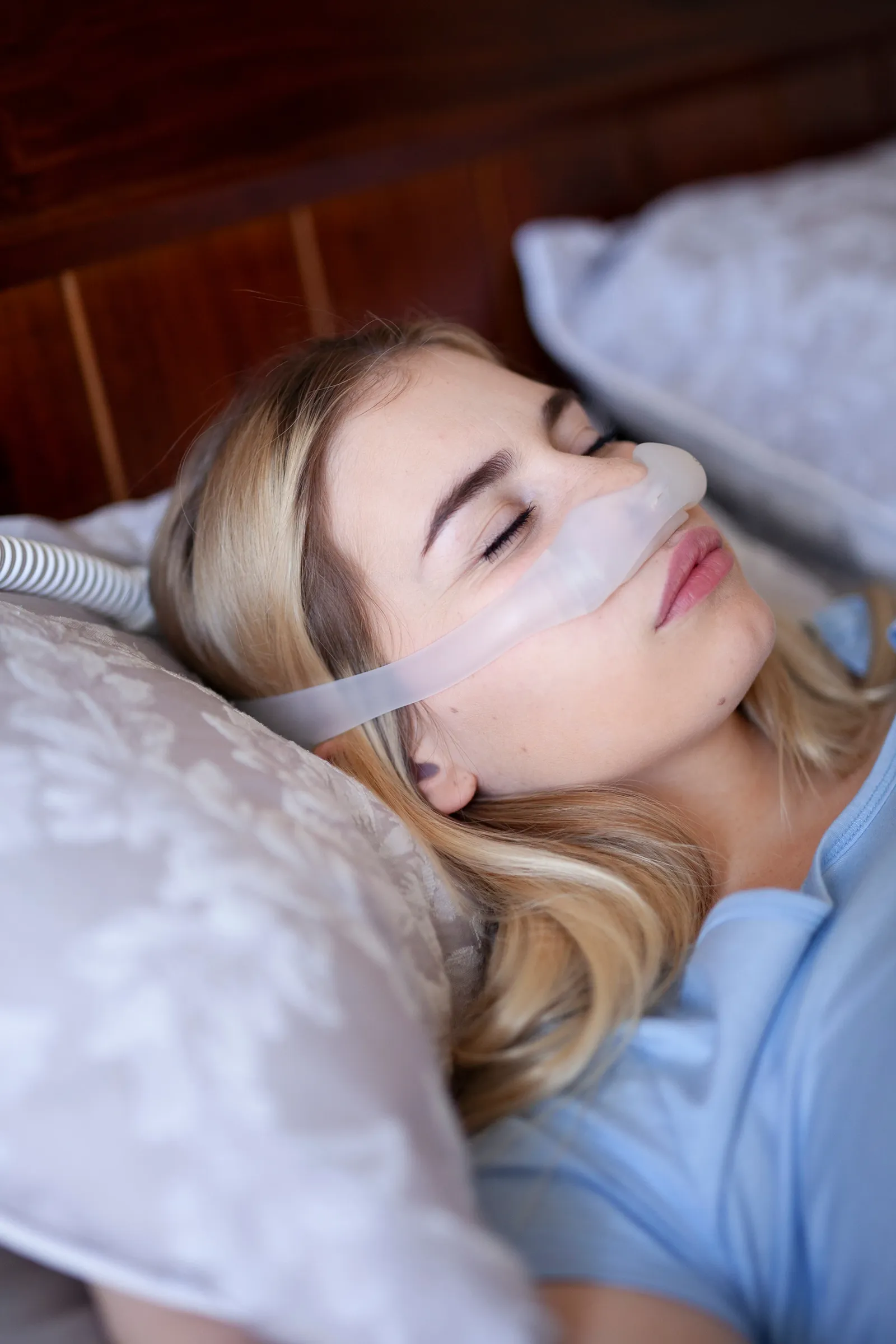 A woman using a CPAP machine